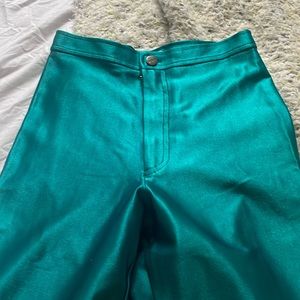 Throwback to early 80s disco era, skin tight shiny green pants!